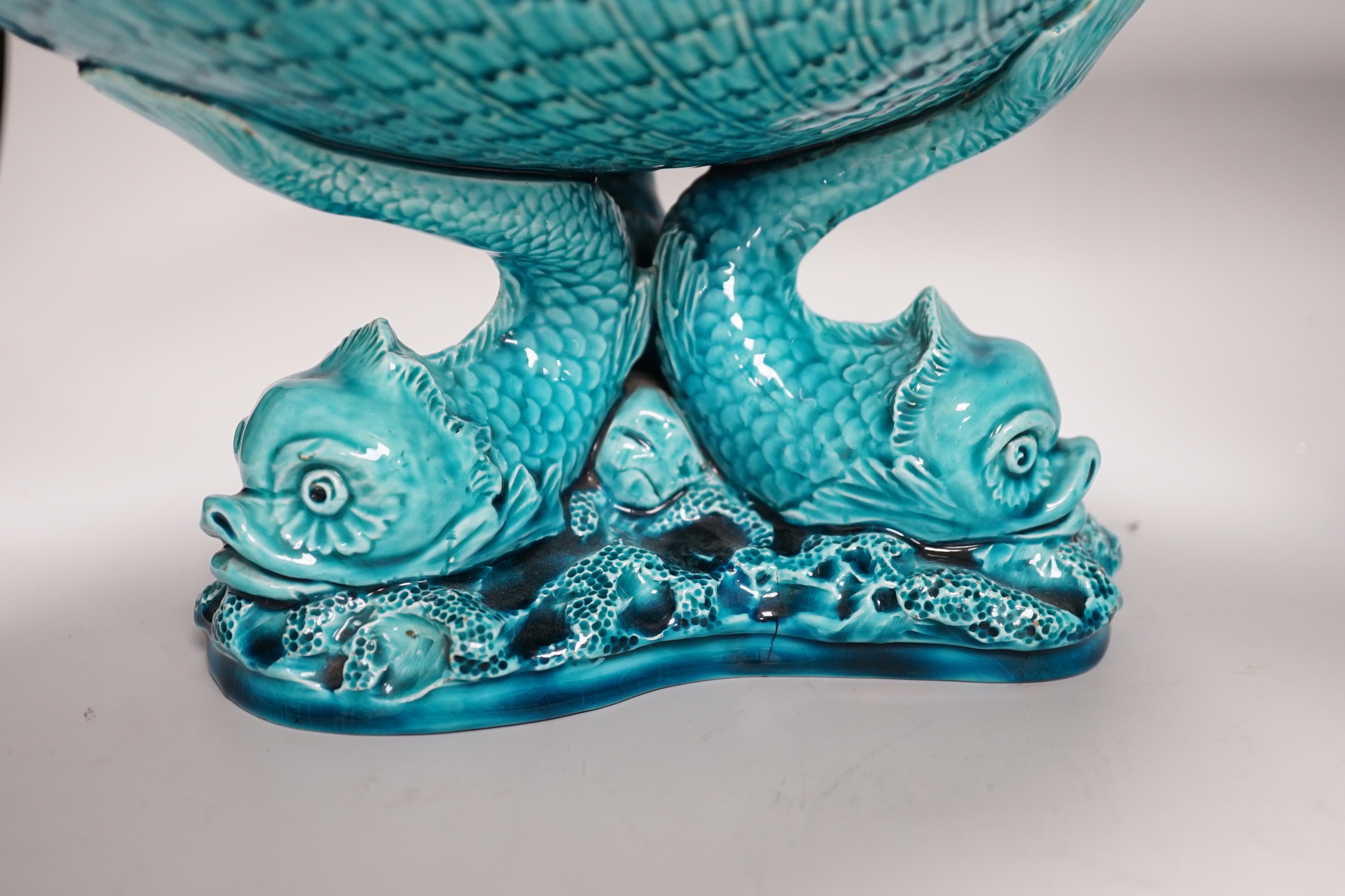 A pair of Burmantofts ‘dolphin’ pedestal bowls and a similar ‘dragon’ vase, 30cm